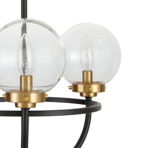 3 light Global view chandelier with globe clear glass shades. Finished in matte black and brushed gold shade holders zoomed in view.