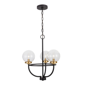 3 light Global view chandelier with globe clear glass shades. Finished in matte black and brushed gold shade holders lit.