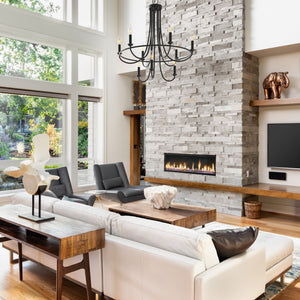 Provincial 9 Light candle style tiered chandelier in a stylish living room, hung above a coffee table.