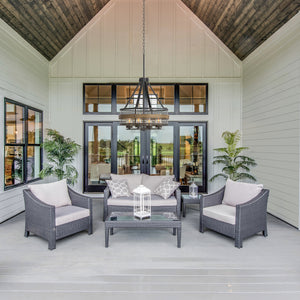 Barnwood outdoor chandelier hanging above a patio set on the outdoor living area.