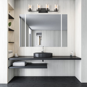 4 light Devonshire vanity light in matte black above a modern bathroom vanity.