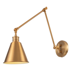 Moti adjustable swing arm wall sconce in brushed gold lit.