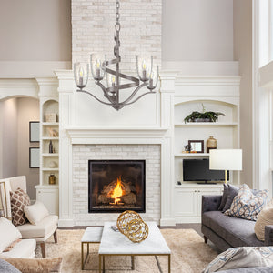 Westbury 5 light chandelier with clear glacial shades hanging above a coffee table in a living room..