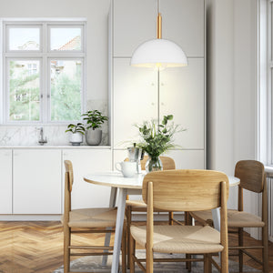 Bari matte white dome pendant above a round dining table.